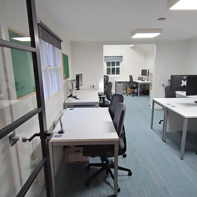 modern office with multiple empty workstations