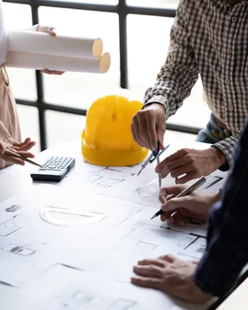 discussing architectural blueprints