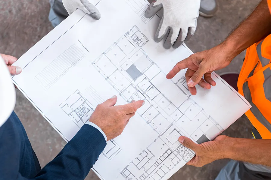 pointing at details on an architectural blueprint