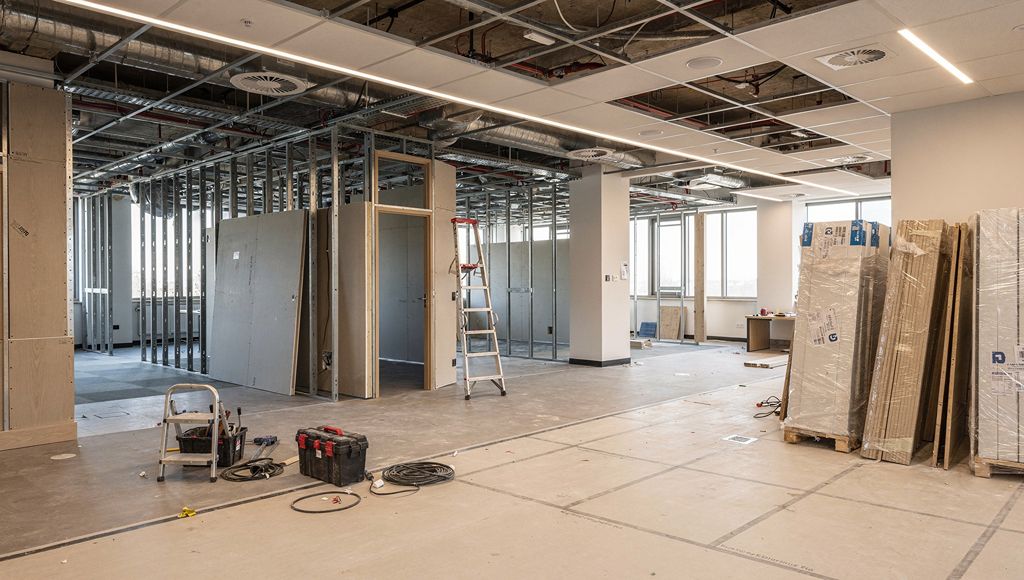 Partitions, ceilings, flooring and building services being coordinated during a commercial refurbishment.